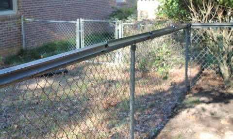 Cat-proof fence paddle kits for Chain Link fence by Oscillot. Simply install the Oscillot kit on top of your existing fence and watch it roll.